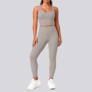 Seamless nude-feel solid gray yoga crop top and high waist leggings apparel detail view.