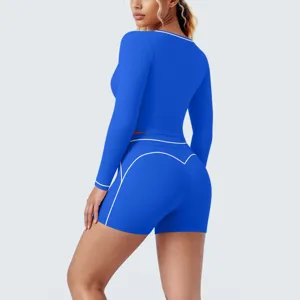 Blue long sleeve crop top and shorts yoga set, contrast trim fitness athletic wear details.