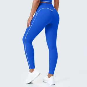 Leggings de yoga azul real de cintura alta con ribetes contrastantes blancos para deporte.