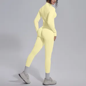 Tuta da yoga fitness con top a maniche lunghe e leggings sportivi gialli senza cuciture