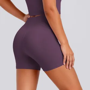 High-waisted purple yoga shorts detail, seamless stretch athletic activewear piece.