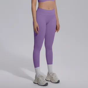 Purple high waist seamless yoga leggings detail, breathable stretch athletic fitness activewear pants.