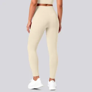 Back detail of high-waisted nude-feel seamless yoga leggings in solid light beige color.