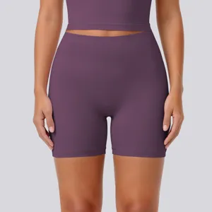 High-waisted athletic yoga shorts and crop top set in deep purple for women fitness workouts.