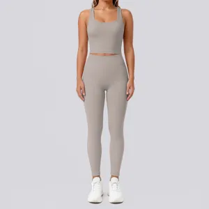 Solid color nude-feel yoga set detail featuring a backless crop top and high-waist leggings.