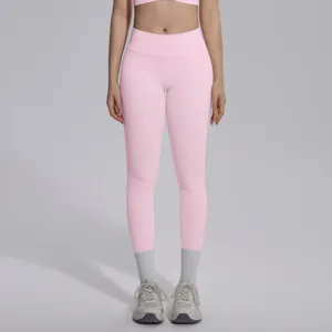 Pink seamless high-waisted yoga leggings, stretchy and breathable for fitness and running.