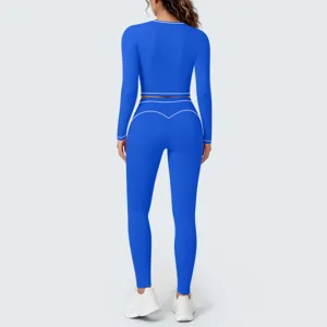 Back view detail of royal blue long sleeve yoga crop top and leggings set with contrast piping.