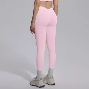 Detailed back view of pink seamless high-waisted yoga leggings for fitness and sports.