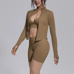 Close-up detail of the seamless khaki athletic zip jacket and shorts activewear set.