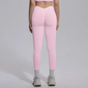 Pink seamless high waist yoga leggings with V-waist design, breathable elastic sportswear.