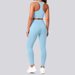 Solid color racerback sports bra and high waist leggings yoga set for women fitness training.