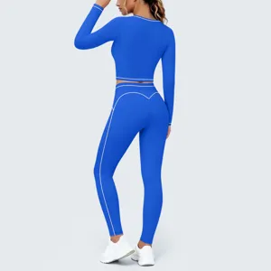 Detail view of the blue yoga set back, featuring contrast white piping and slim fit design.