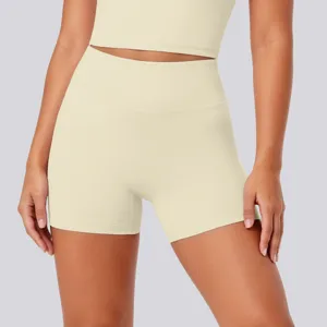Detail shot of high-waisted yoga shorts in light yellow, premium stretchy and breathable fabric.