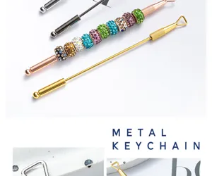 Stainless steel cuticle pusher double ended nail art tool with colorful rhinestones decor.