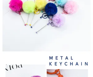 Colorful fluffy pom pom keychain with metal wand design, cute plush bag charm accessory.
