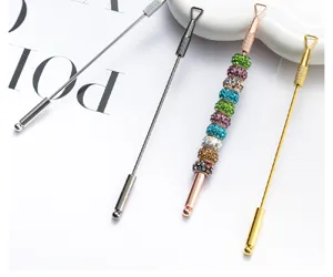 Stainless steel nail art cuticle pusher detail closeup, dual head dead skin removal tool.