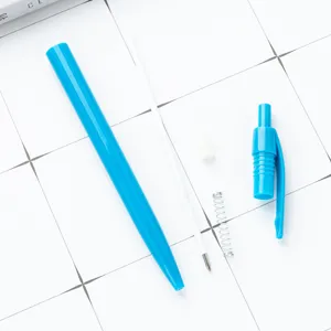 Plastic click ballpoint pen disassembled parts view showing barrel refill spring and cap.
