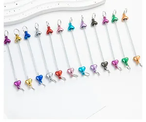 Detailed view of colorful DIY metal beaded heart rods and zipper pull keychain accessories.