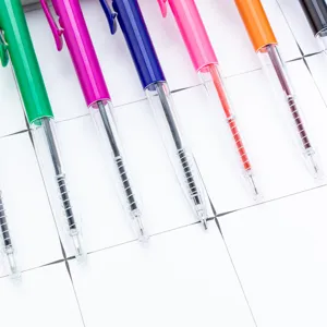 Colorful plastic ballpoint pens with clear barrels, retractable design for office and gifts.