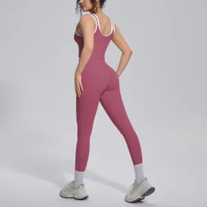 Women's two-piece pink activewear set with contrast tank top and breathable leggings.