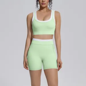 Close-up details of the light green color-blocked activewear sports bra and shorts set.
