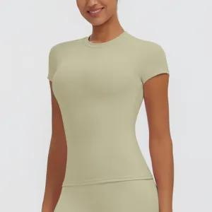 Close-up detail of women's short sleeve slim fit quick dry yoga fitness top apparel.