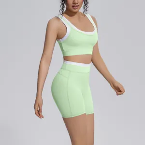Detail view of women colorblock yoga set, featuring a supportive sports bra and high waist shorts.