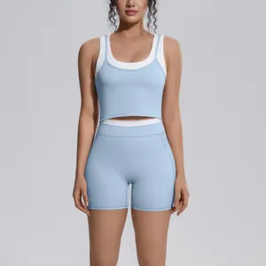 Stylish two-piece athletic yoga set featuring a blue layered tank top and matching shorts.