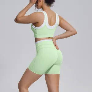 Light green contrast women yoga set sports bra and fitness shorts for running gym activewear.