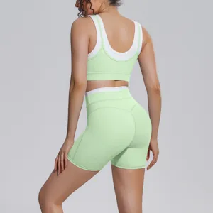 Rear detail of contrast activewear set showing scoop back and supportive athletic straps.