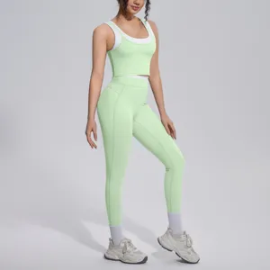 Women fitness yoga set contrast color ribbed tank top and breathable high stretch leggings.