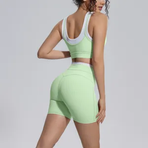 Contrast color workout yoga set for women, including sports bra and high waist shorts.