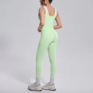 Light green yoga set for women, breathable ribbed tank top and high waist fitness gym leggings.