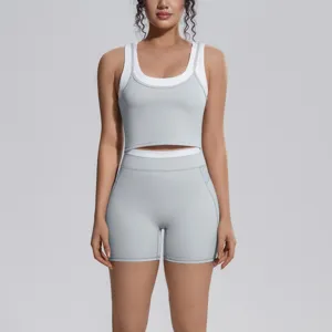 Detail view of stylish two-piece yoga set, featuring breathable elastic crop top and matching shorts.