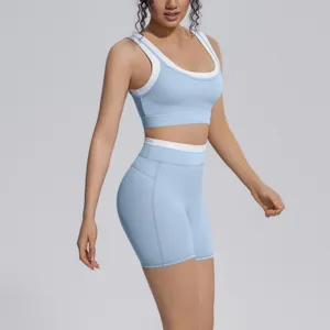 Detail shot of light blue contrast sports bra and yoga shorts, soft stretch fitness activewear.