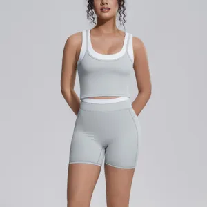 Breathable two-piece yoga set featuring a stylish contrast crop tank and snug athletic shorts.