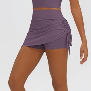 High waist ruched athletic tennis skirt with built-in shorts for yoga gym running fitness workouts.