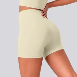 Detail view of high-waisted yoga shorts in light beige, offering a supportive fit for fitness.
