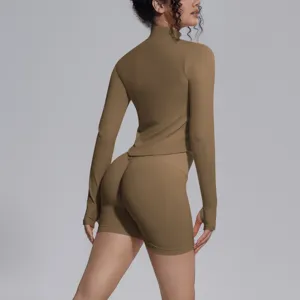 Seamless long sleeve activewear set with high waist shorts for fitness yoga running.