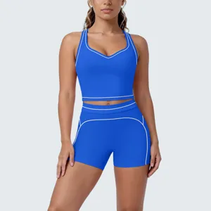 Detail view of the contrast piping women yoga workout two-piece set, activewear style.