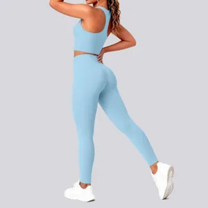 Light blue sports yoga set, sleeveless backless top and high-waisted leggings for active women.