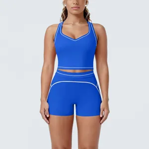 Women contrast trim athletic yoga set, racerback crop top and tight shorts for running and fitness.