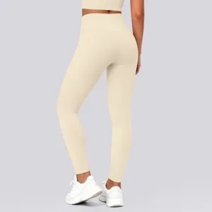Detailed rear view of high-waisted seamless push-up yoga leggings in nude beige color.