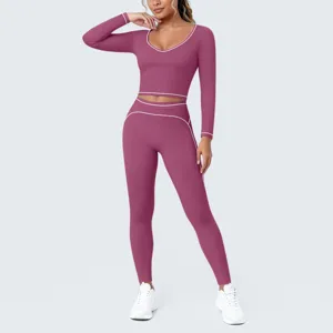 Detailed view of women long sleeve crop top and high waist leggings fitness yoga set.