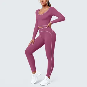 Detailed view of the women's athletic yoga set featuring long sleeves and contrast piping.