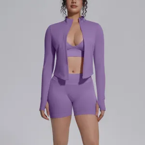 Seamless purple activewear 3-piece athletic set featuring long sleeve zip jacket and shorts.