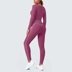 Back view of women's contrast piping long sleeve crop top and leggings fitness yoga activewear set.