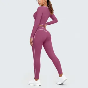 Detailed back view showing the mauve long sleeve crop top and high waist yoga leggings set.