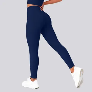 Detail view of high waist solid color butt lifting yoga pants in dark blue color design.