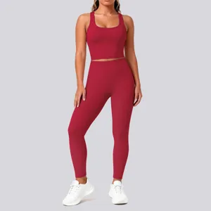 Solid color athletic yoga set featuring a supportive crop top and matching leggings for fitness.